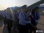 洛阳警方奔赴柬埔寨　押解十三名电信诈骗嫌疑人回国